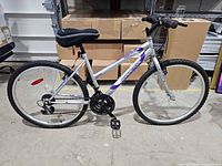 Full right-side view of bicycle showing frame, wheels, saddle cover