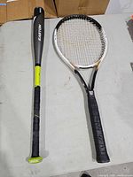 Racket and bat full view on table
