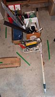 Overall lot view with boxes of tools and extension pole