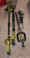 Three Radley cordless garden tools laid out on floor