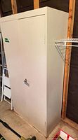 Full front view of metal cabinet closed