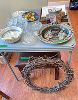 Overview showing all ceramic pieces, crystal glassware, framed print and twig wreath