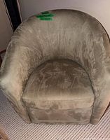 Front view of one taupe microsuede swivel scoop chair