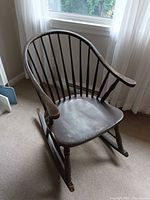 Full view of wooden Windsor rocking chair