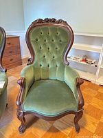 Full view of chair front showing upholstery, frame and legs