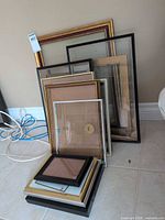 Stacked assorted frames showing variety of sizes and finishes