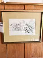 Full view of framed ink sketch on wall