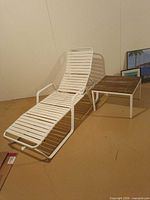 Lounge chair and one side table in full view