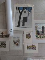 Group photo of all unframed prints and rolled poster