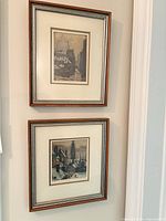 Two framed Hornyansky aquatints hung vertically