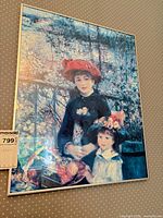 Full view of framed Renoir print on wall