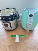 Instant Pot pressure cooker and Ultrean teal air fryer side by side