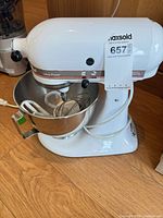 White KitchenAid Ultra Power mixer with bowl and attachments mounted