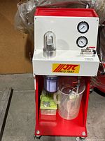 Front view showing gauges, reservoir, filter, jug and adaptor kit