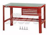 Stock image of assembled red steel workbench with green top and drawer unit