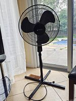 Full view of Atlantic Breeze pedestal fan showing stand, base and power cord