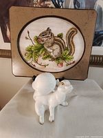 Overall view of plaque and figurine