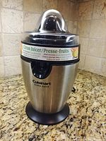 Front view of stainless steel Cuisinart citrus juicer, full unit visible