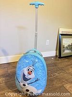 Olaf suitcase standing with telescoping handle extended