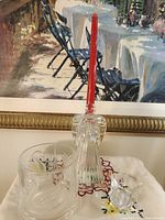 All items together: angel candle holder, tumbler, swan salt cellar, red taper