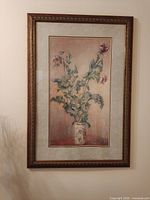 Full view of framed floral print on wall