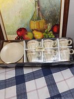 Boxed set showing six cups and six saucers