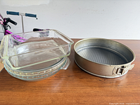 Stack of glass baking dishes and Zenker springform pan