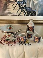 Full set showing bowl, sake bottle, three cups