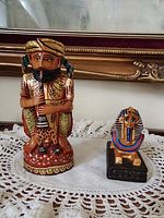 Front view of both figurines showing overall design and relative size