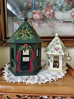 Front view of both birdhouses on table doily