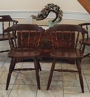front view of both Windsor dining chairs in lot