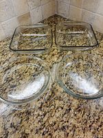 Group shot of all four Pyrex glass dishes on countertop