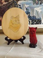 Full view of Royal Doulton Flambé cat figurine, wooden cat plaque on easel