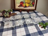 All twelve cut glass sherbet glasses on table