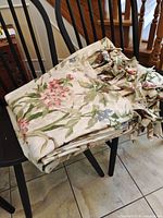 Folded panels showing floral print and tie tops