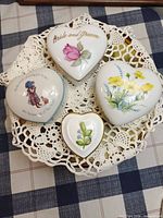Top view of all four closed heart-shaped trinket boxes