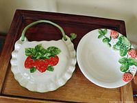 Wall pocket and bowl side by side on wooden surface