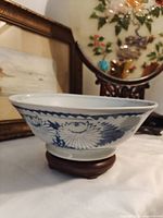 Side view showing blue chrysanthemum motif and wave border