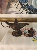 Lamp and rabbit figurine together, shows scale and patina