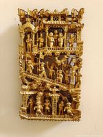 Front view of layered carved wood panel