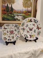 Both plates on stands showing overall designs
