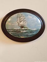 Full view of oval plaque on wall