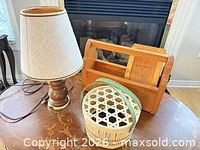 Group view of lamp, rack, basket