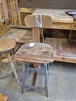 overall view of metal stool showing seat/back and finish wear