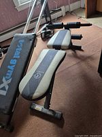 Full view of Marcy ab bench showing frame, pad, foam rollers