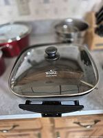 Front view of Rival electric skillet with glass lid in place