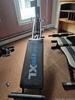 Full view of Total Gym XL trainer with bench and frame