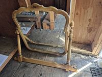 Full view of cheval mirror showing frame, posts, base