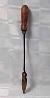 Full view of soldering iron showing handle, shaft, tip