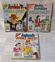 Front covers of all three Double Digest comic books